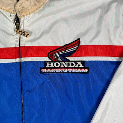 Digg It Thrift & Vintage reversible Honda Racing Team windbreaker jacket with red, white, and blue racing stripes.