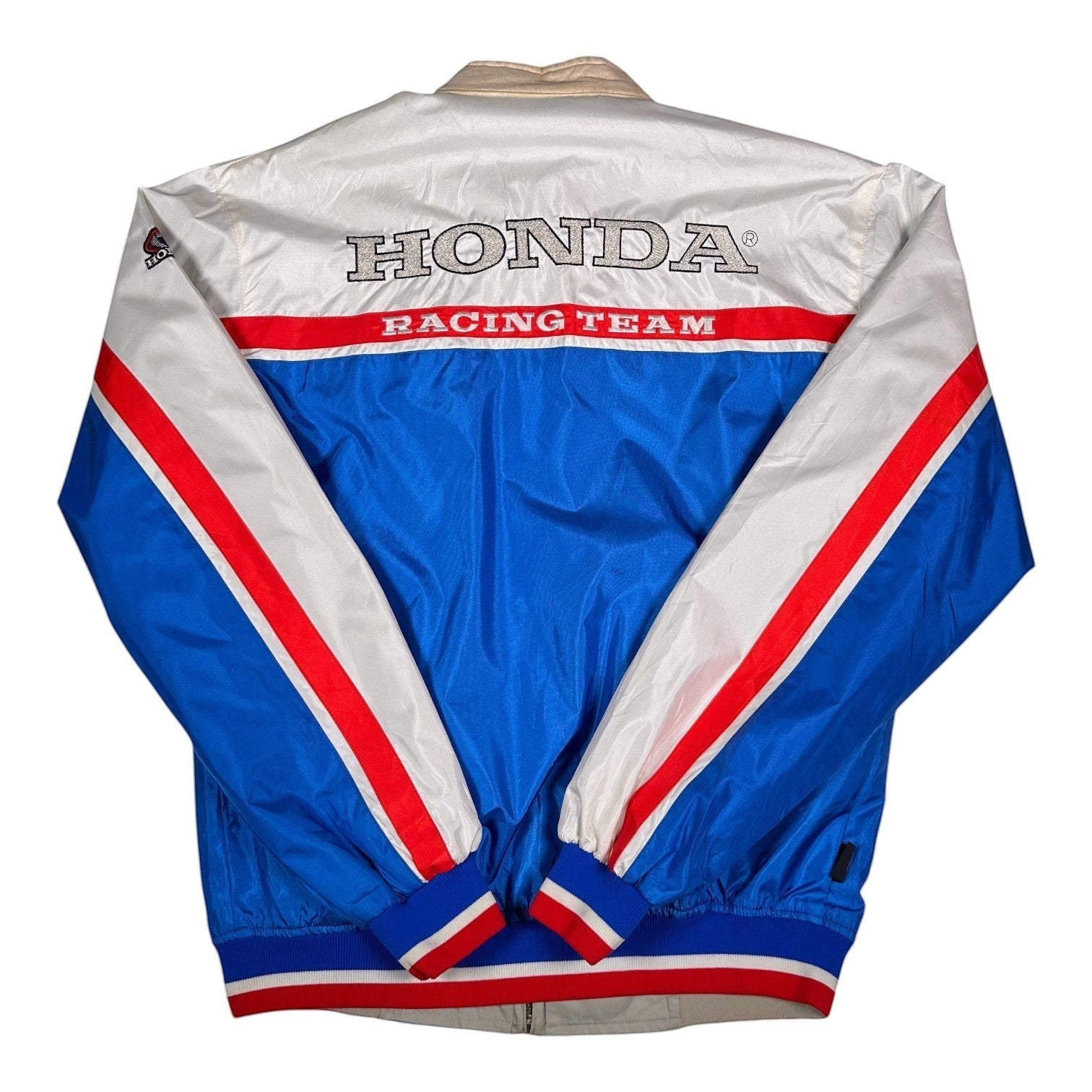 Digg It Thrift & Vintage reversible Honda Racing Team windbreaker jacket in white, blue, and red with back embroidery.