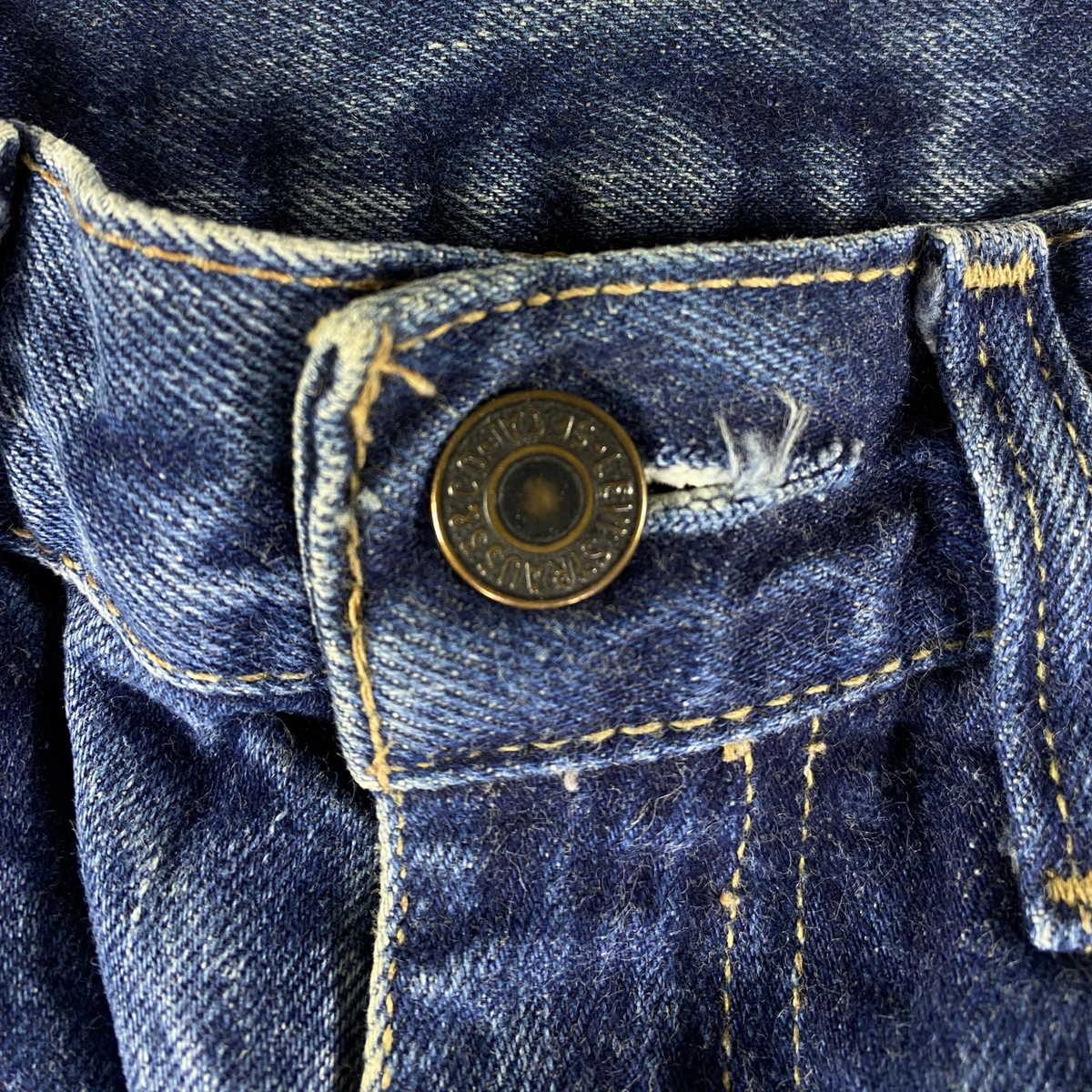 Digg It Thrift & Vintage Levi's 607 blue denim jeans featuring a classic branded metal button closure