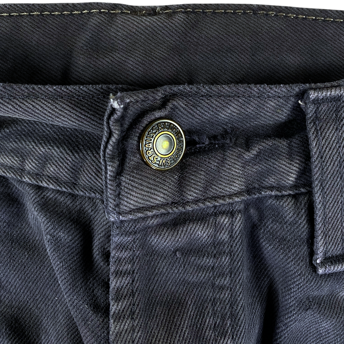 Digg It Thrift & Vintage Levi's 618 faded black denim jeans featuring a branded metal button and sturdy stitching.