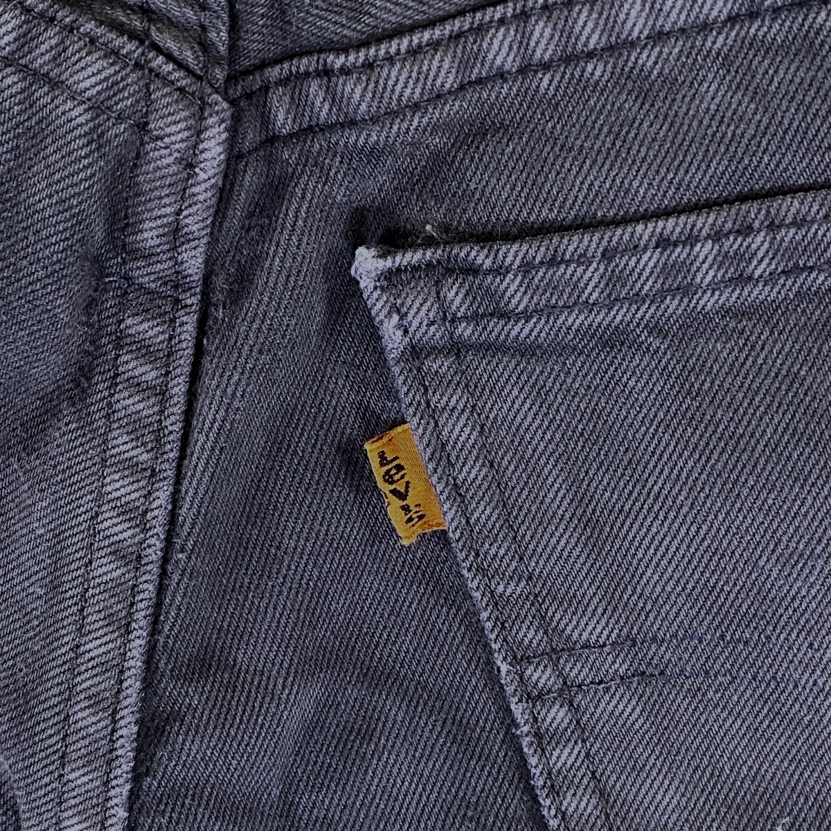 Digg It Thrift & Vintage Levi's 618 faded black denim jeans featuring the iconic orange tab detail.