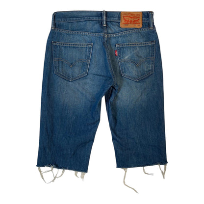 Digg It Thrift & Vintage Levi's 511 slim fit blue denim jorts with a raw hem and back leather patch