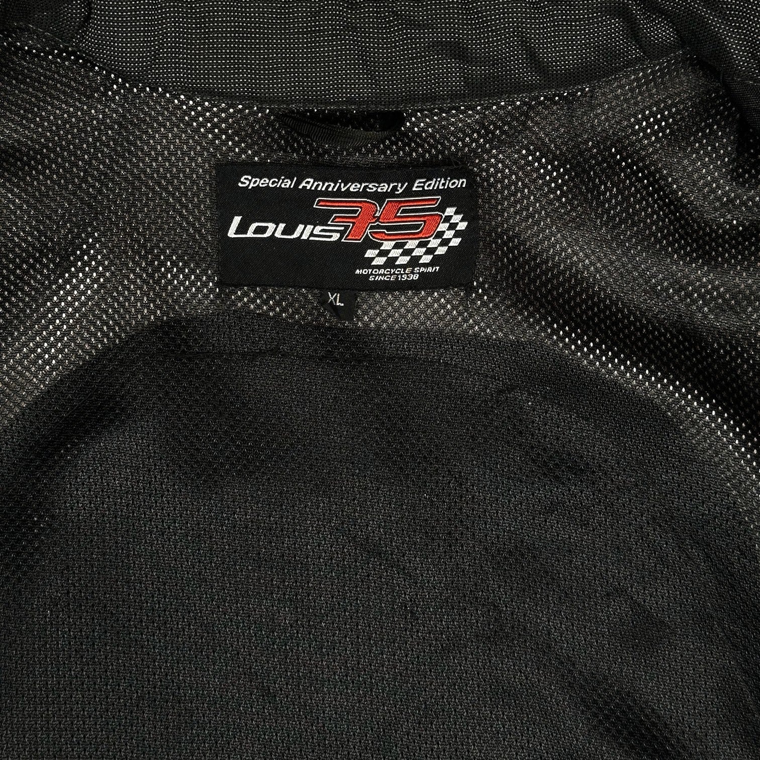 Digg It Thrift & Vintage Louis 75th Anniversary Edition motorcycle jacket interior label with mesh lining