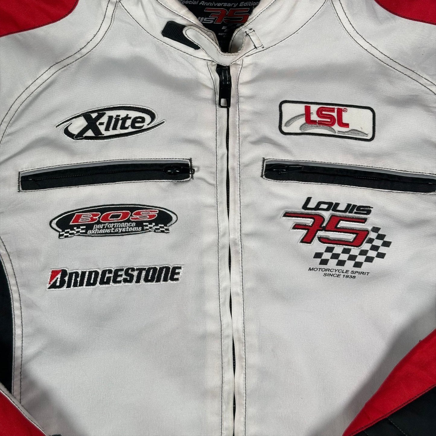 Digg It Thrift & Vintage Louis 75th Anniversary white motorcycle racing jacket with red accents and sponsor patches