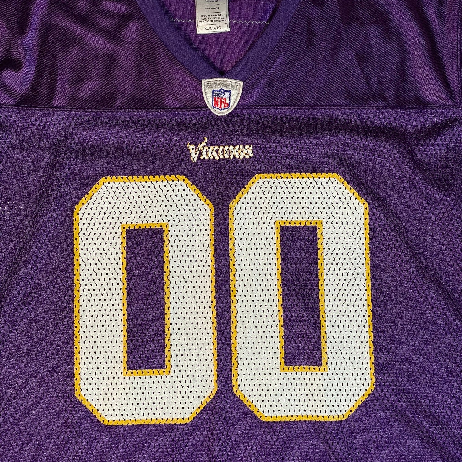 Digg It Thrift & Vintage purple Minnesota Vikings NFL jersey with white and yellow 00 numbers and mesh fabric