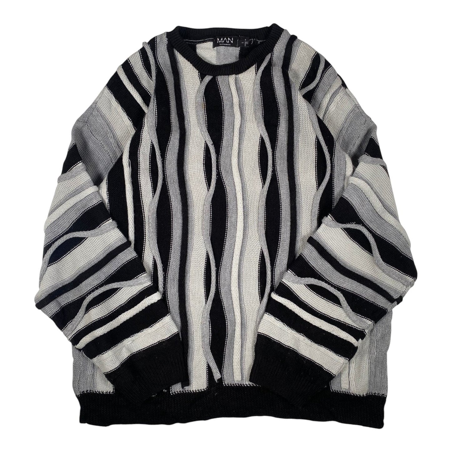Digg It Thrift & Vintage boohooMAN monochromatic wavy cable knit crewneck sweater in black, grey, and white.