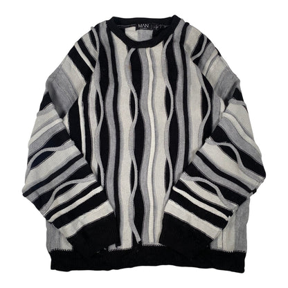 Digg It Thrift & Vintage boohooMAN monochromatic wavy cable knit crewneck sweater in black, grey, and white.