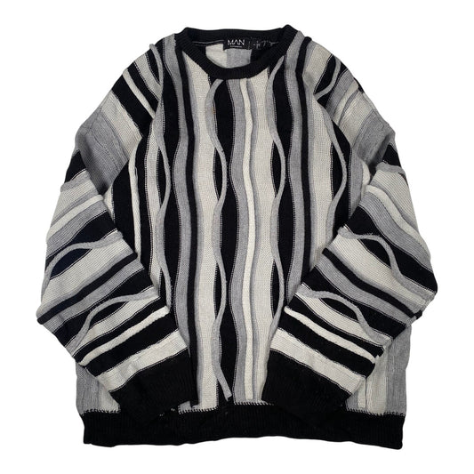 Digg It Thrift & Vintage boohooMAN monochromatic wavy cable knit crewneck sweater in black, grey, and white.