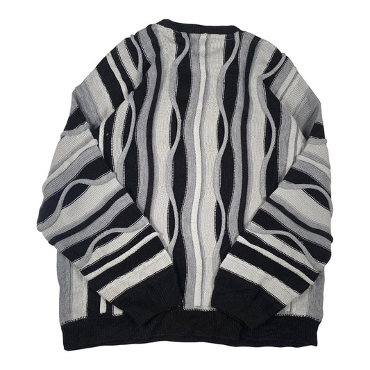 Digg It Thrift & Vintage boohooMAN monochromatic wavy cable knit sweater with black, grey, and white vertical stripes.