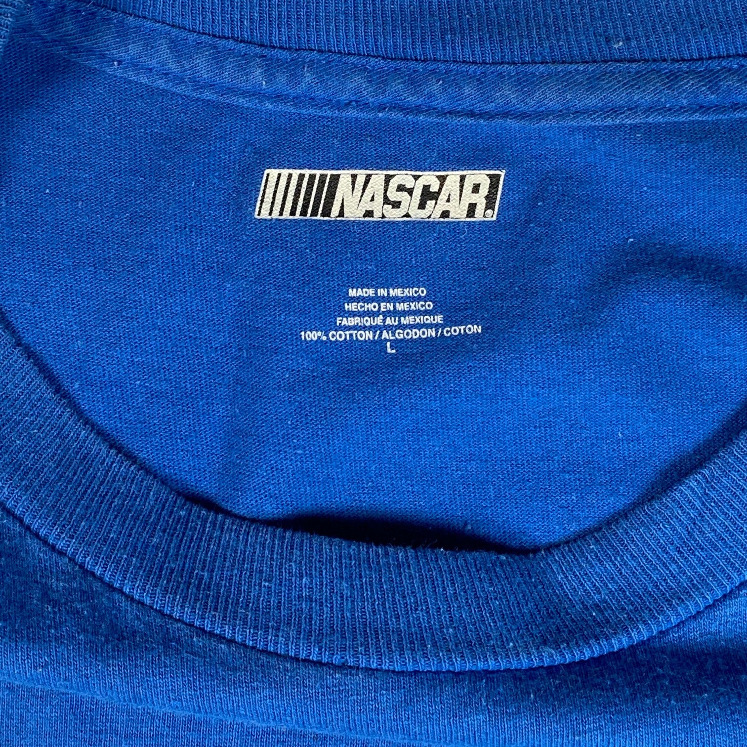 Digg It Thrift & Vintage royal blue NASCAR cotton t-shirt interior neck label showing size large