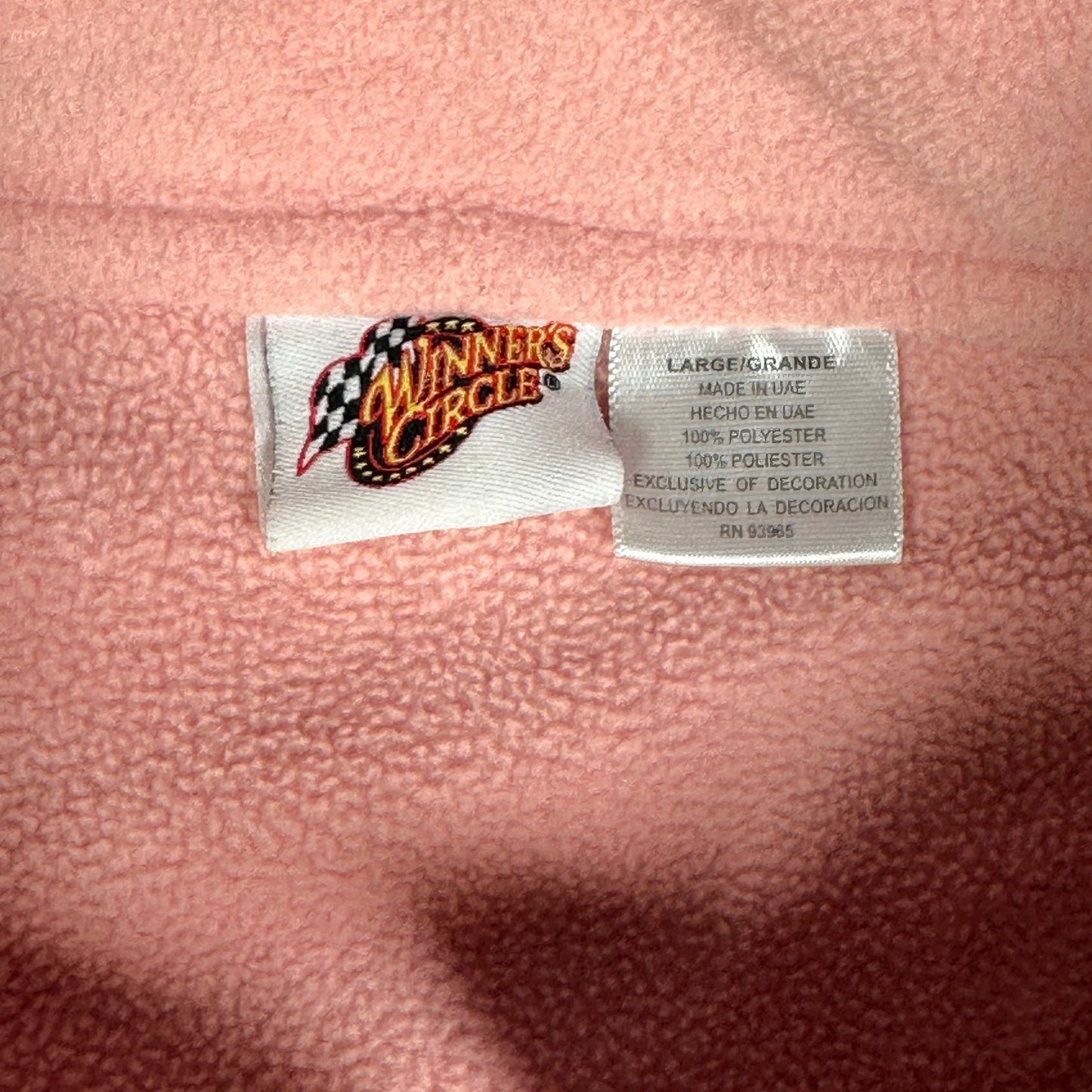 Digg It Thrift & Vintage Winner's Circle NASCAR pink fleece sweater interior tag showing size large and material