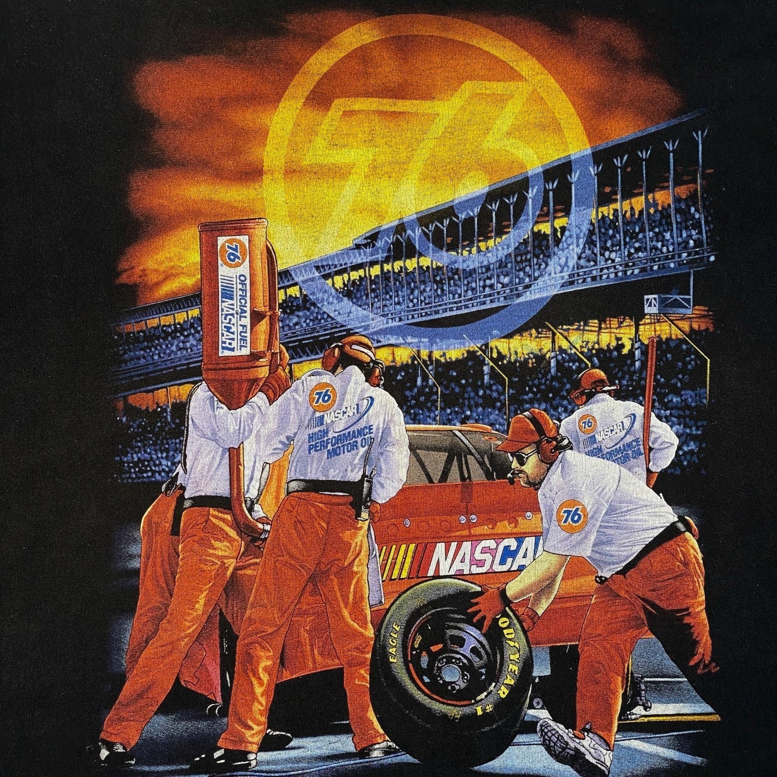 Digg It Thrift & Vintage NASCAR Union 76 pit crew graphic t-shirt featuring a race track scene on black cotton