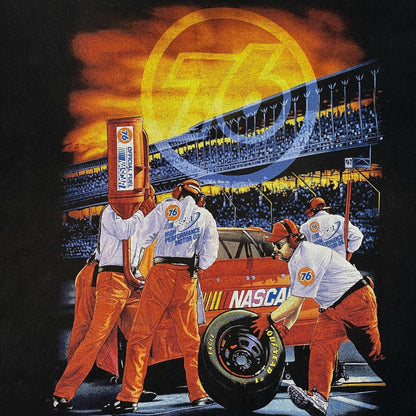 Digg It Thrift & Vintage NASCAR Union 76 pit crew graphic t-shirt featuring a race track scene on black cotton