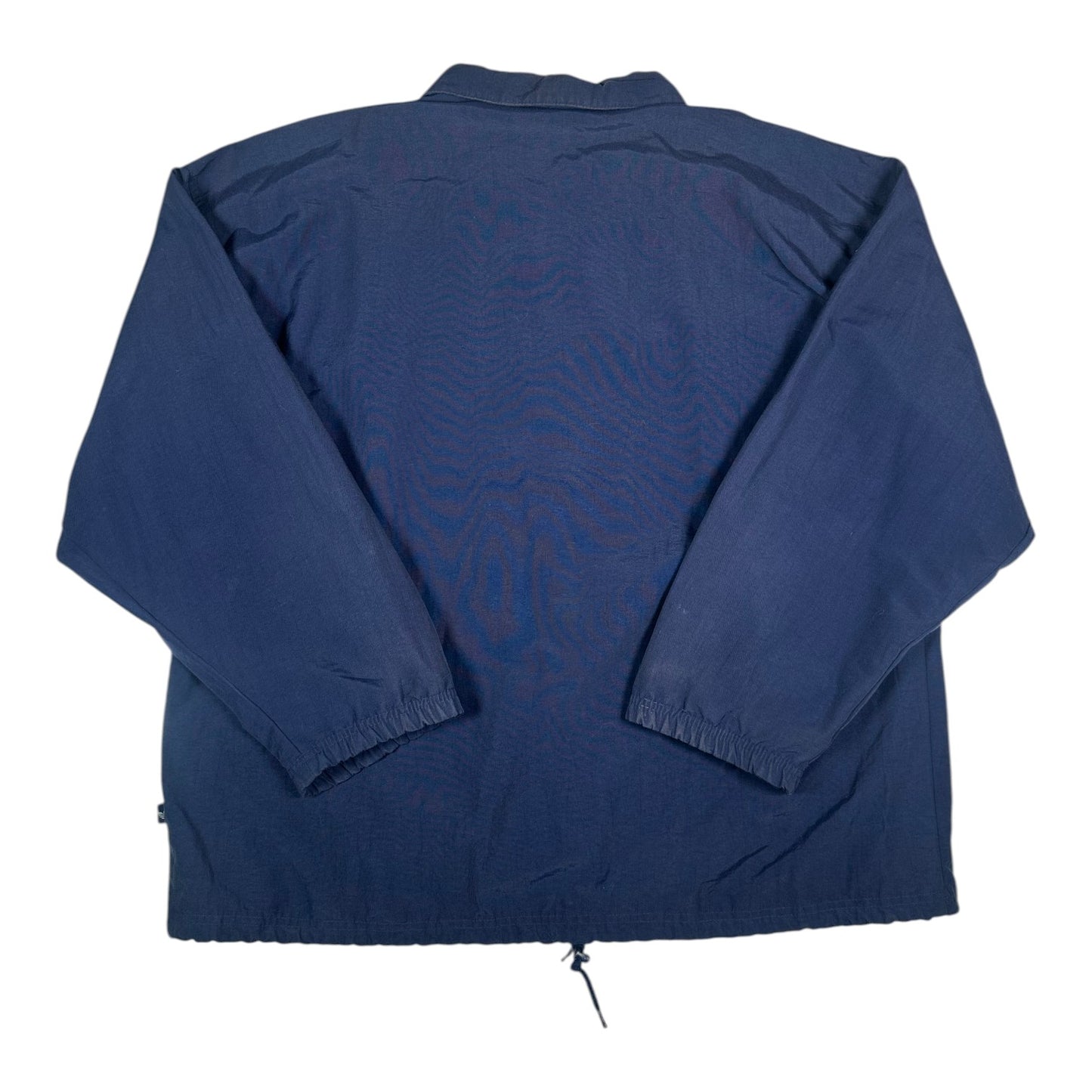 Back view of a navy blue Adidas coach jacket from Digg It Thrift & Vintage with a drawstring hem and elastic cuffs.