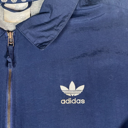 Digg It Thrift & Vintage navy Adidas coach jacket with white embroidered Trefoil logo and full zip closure