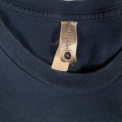 Digg It Thrift & Vintage navy blue concert t-shirt with Next Level Apparel tag at the neckline