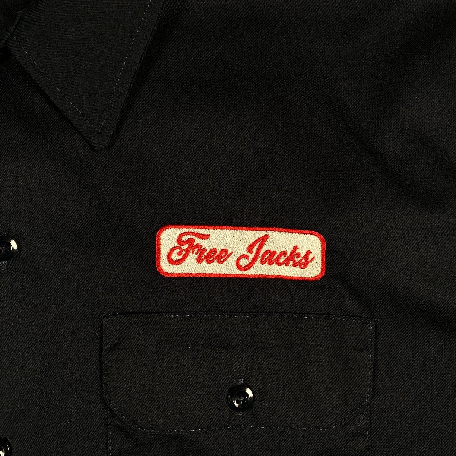 Digg It Thrift & Vintage navy Dickies work shirt with embroidered Free Jacks patch on the chest pocket