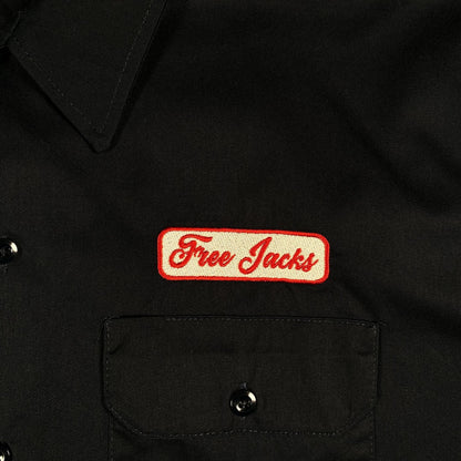 Digg It Thrift & Vintage navy Dickies work shirt with embroidered Free Jacks patch on the chest pocket