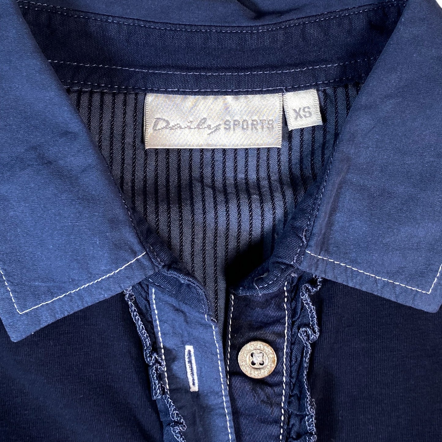 Digg It Thrift & Vintage navy Daily Sports golf polo shirt with a ruffle placket and white contrast stitching