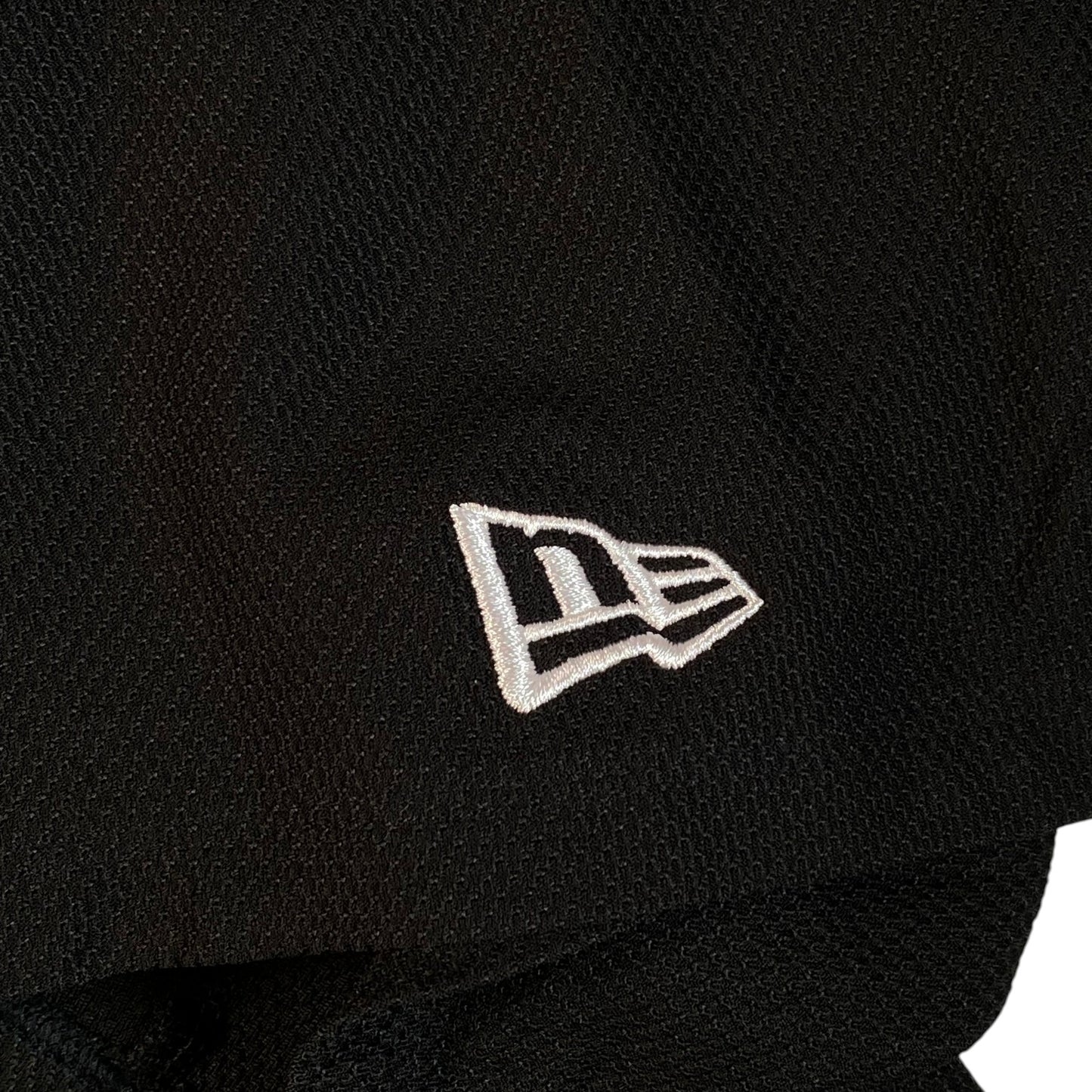Digg It Thrift & Vintage New Era x Muerte Hustle baseball jersey featuring white embroidered logo on black fabric