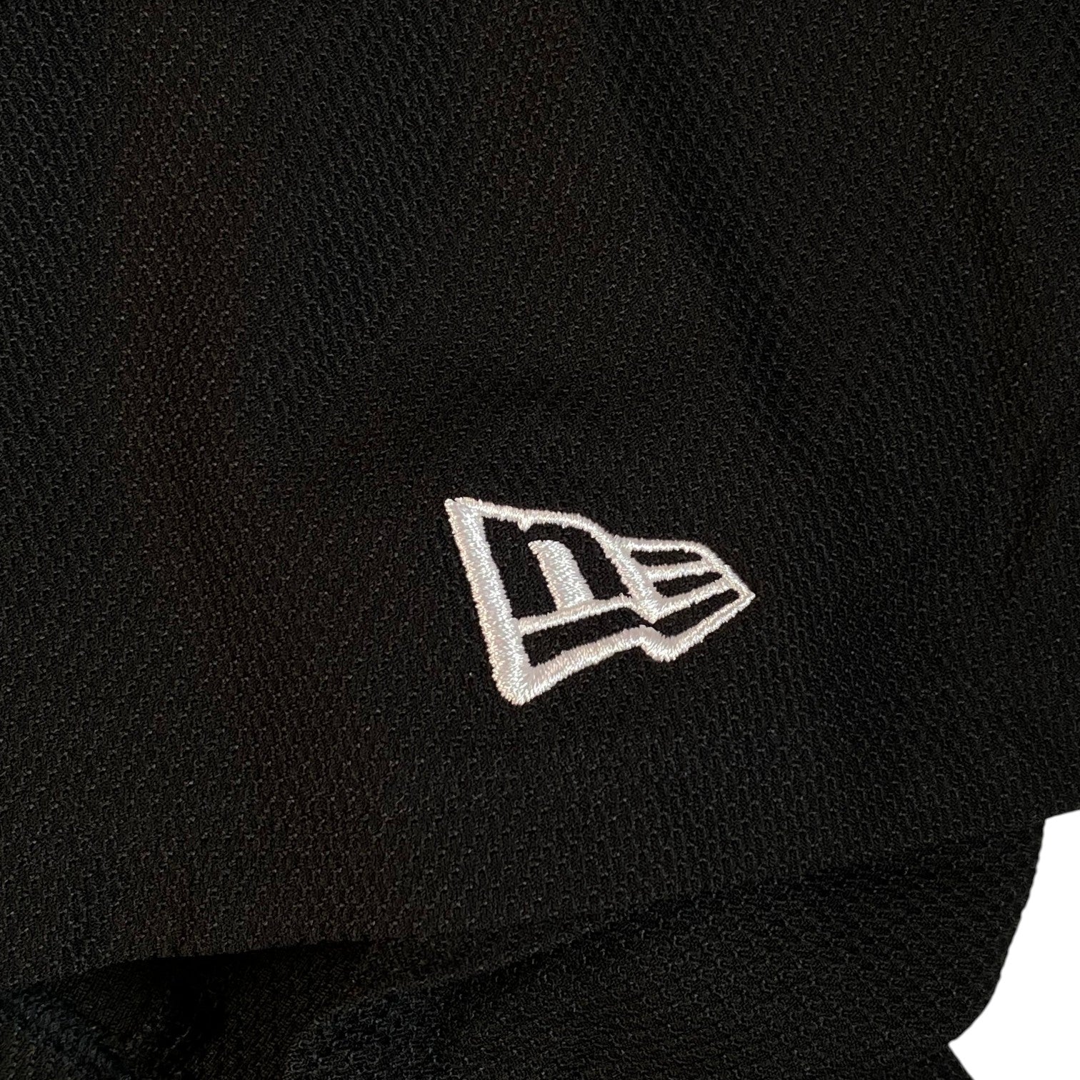 Digg It Thrift & Vintage New Era x Muerte Hustle baseball jersey featuring white embroidered logo on black fabric
