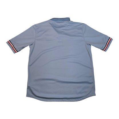 Back view of a light blue 2011-2012 Nike France away football shirt with red and white striped sleeve cuffs.