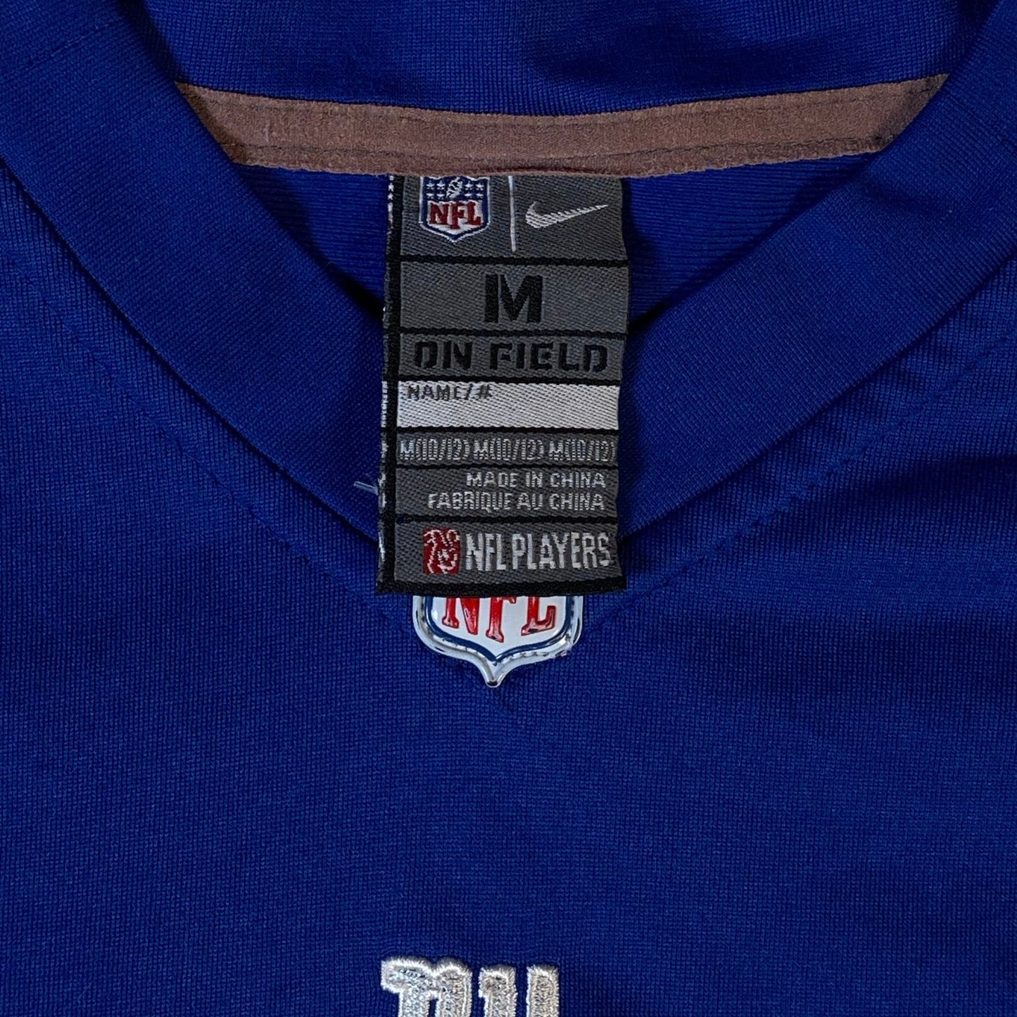 Digg It Thrift & Vintage Nike NFL New York Giants Victor Cruz jersey tag showing size M on field label