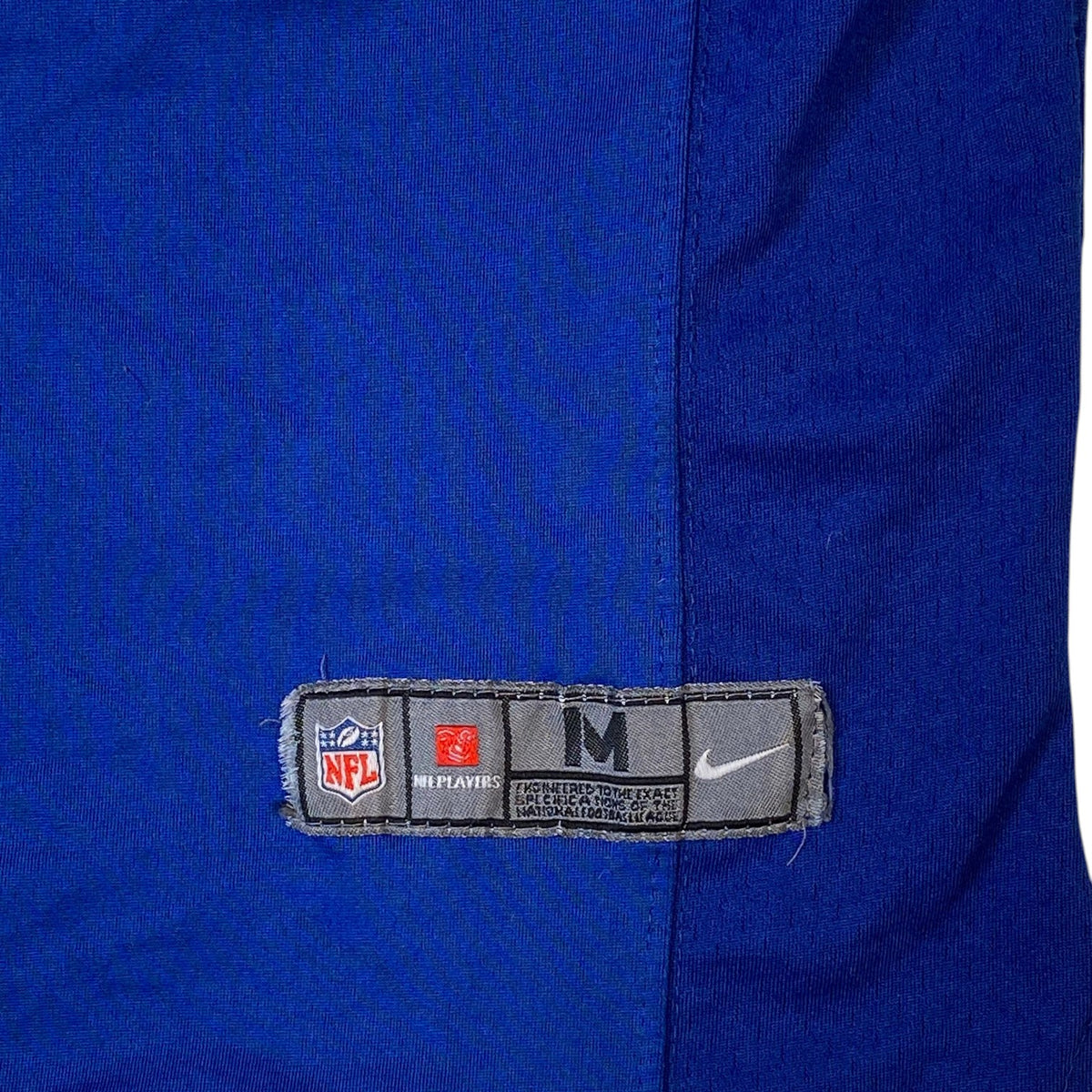 Digg It Thrift & Vintage Nike NFL New York Giants jersey size medium tag detail in royal blue