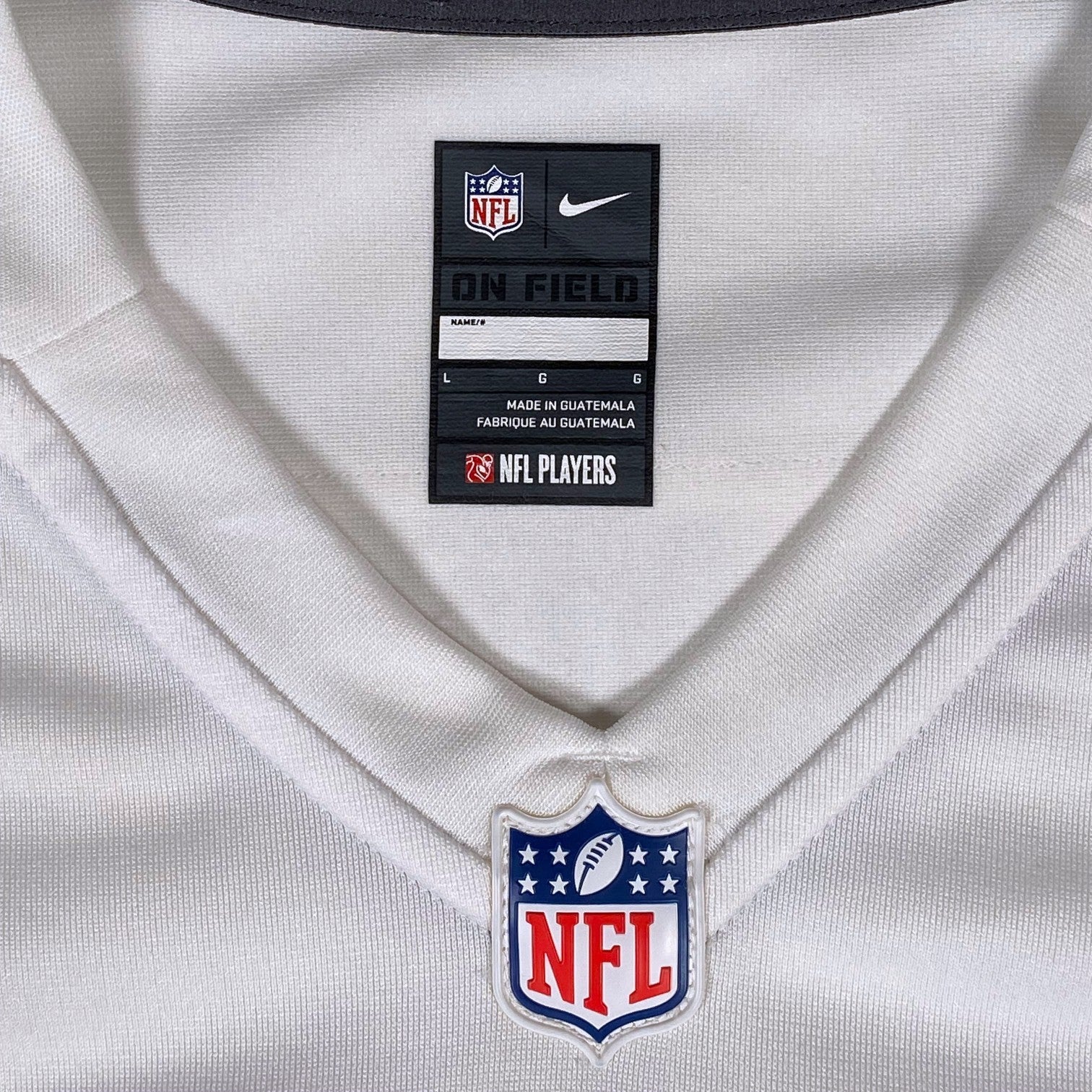 Digg It Thrift & Vintage white Nike On Field NFL jersey collar with official league branding and size large tag
