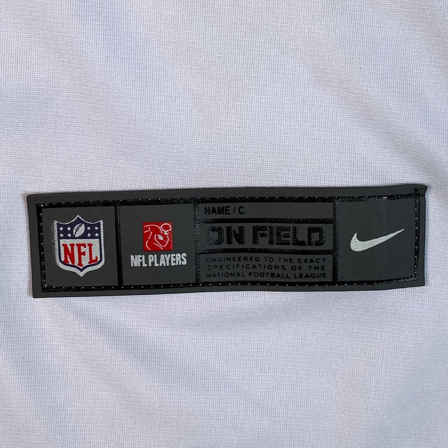 Digg It Thrift & Vintage Nike On Field NFL Kansas City Chiefs jersey jock tag on white fabric