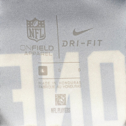 Digg It Thrift & Vintage Nike On Field NFL jersey interior tag showing size Large and Dri-Fit technology details