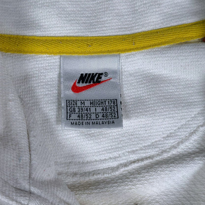 Digg It Thrift & Vintage Nike sweatshirt interior tag showing size medium and Nike branding on white fabric