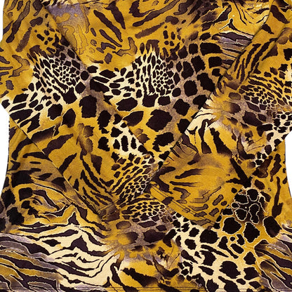 Digg It Thrift & Vintage ochre long sleeve V-neck top featuring a bold mixed animal print pattern