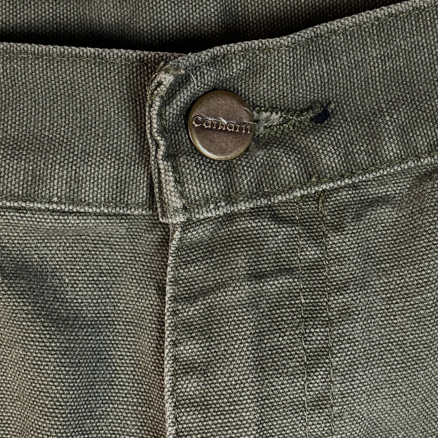 Digg It Thrift & Vintage olive green Carhartt canvas carpenter shorts featuring a branded metal button detail
