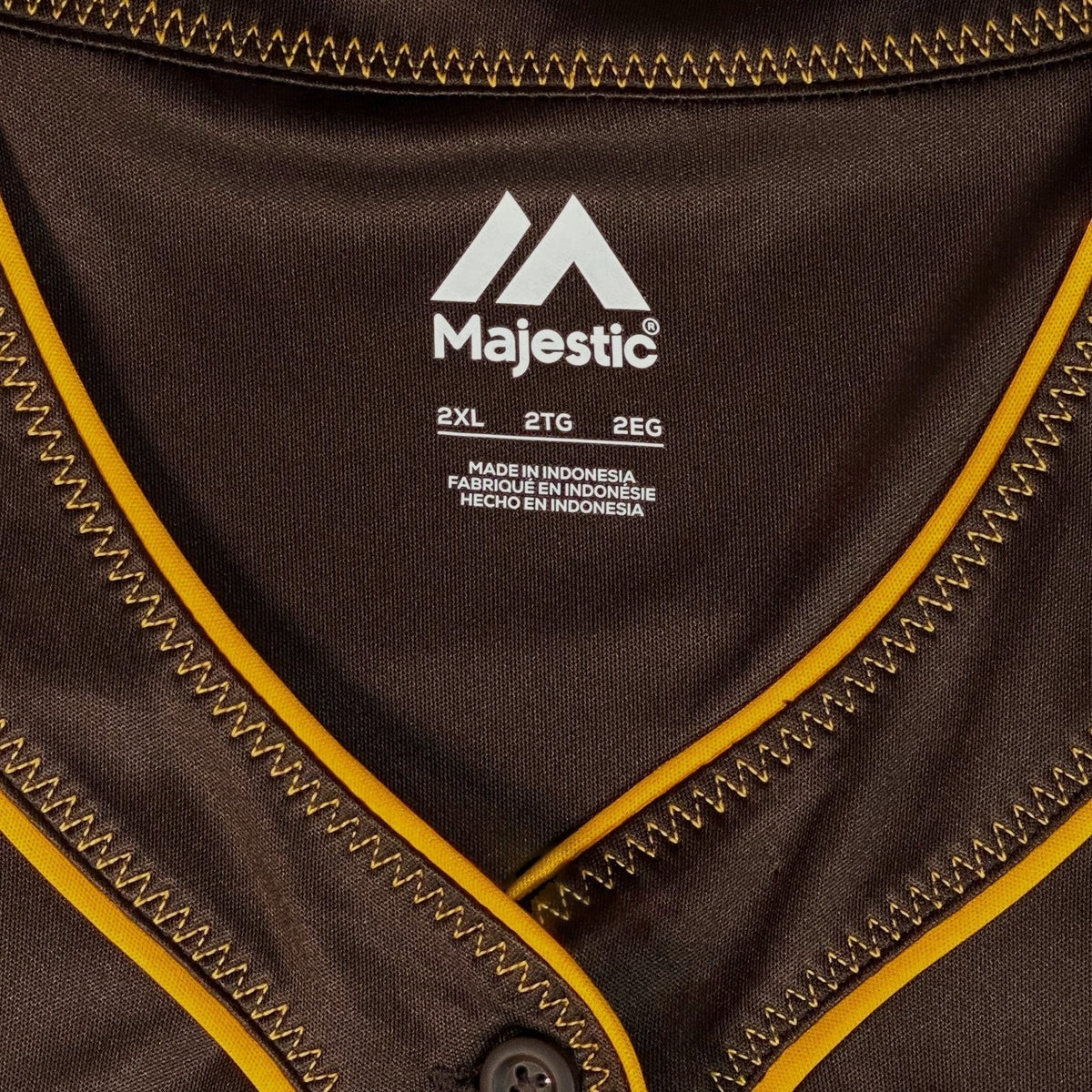Digg It Thrift & Vintage Majestic San Diego Padres baseball jersey collar with brown fabric and gold trim detail