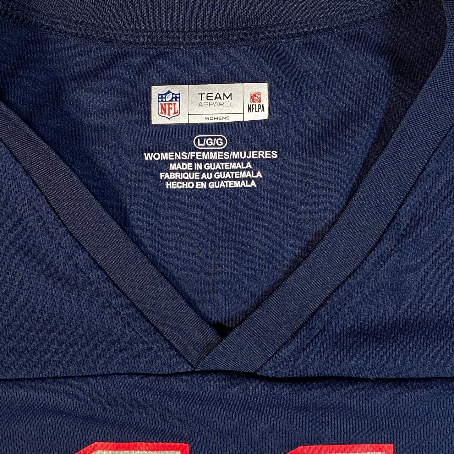 Digg It Thrift & Vintage New England Patriots women's jersey interior neck label showing size L/G/G in navy blue