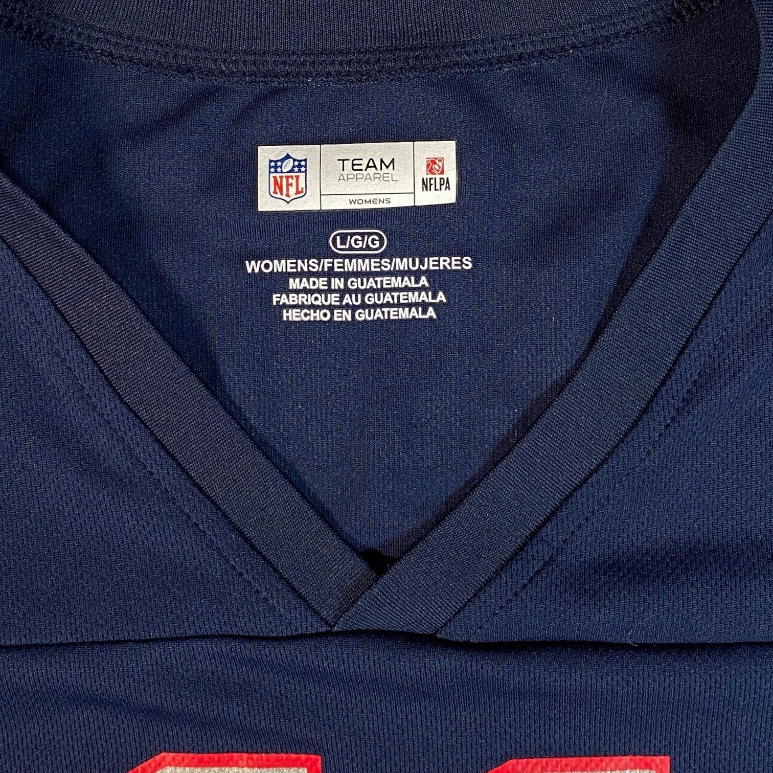 Digg It Thrift & Vintage New England Patriots women's jersey interior neck label showing size L/G/G in navy blue