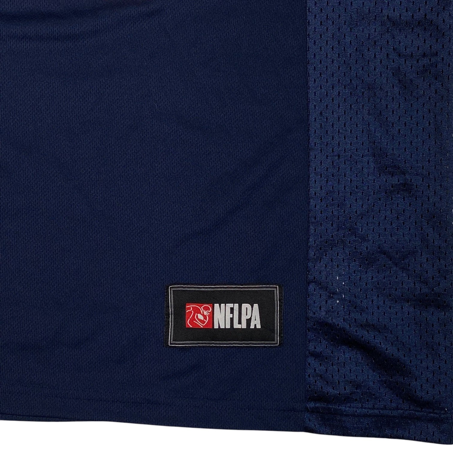 Digg It Thrift & Vintage New England Patriots jersey featuring an NFLPA patch on navy blue mesh fabric