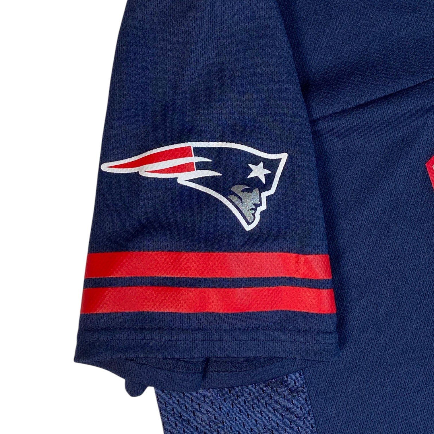 Digg It Thrift & Vintage New England Patriots jersey sleeve with team logo and red stripes on navy blue mesh fabric