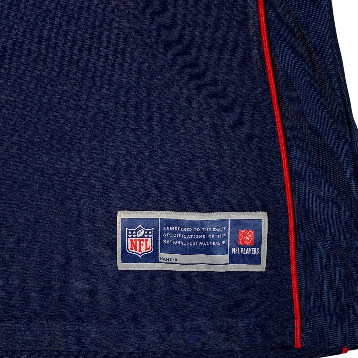Digg It Thrift & Vintage New England Patriots NFL jersey jock tag detail in navy blue with red trim