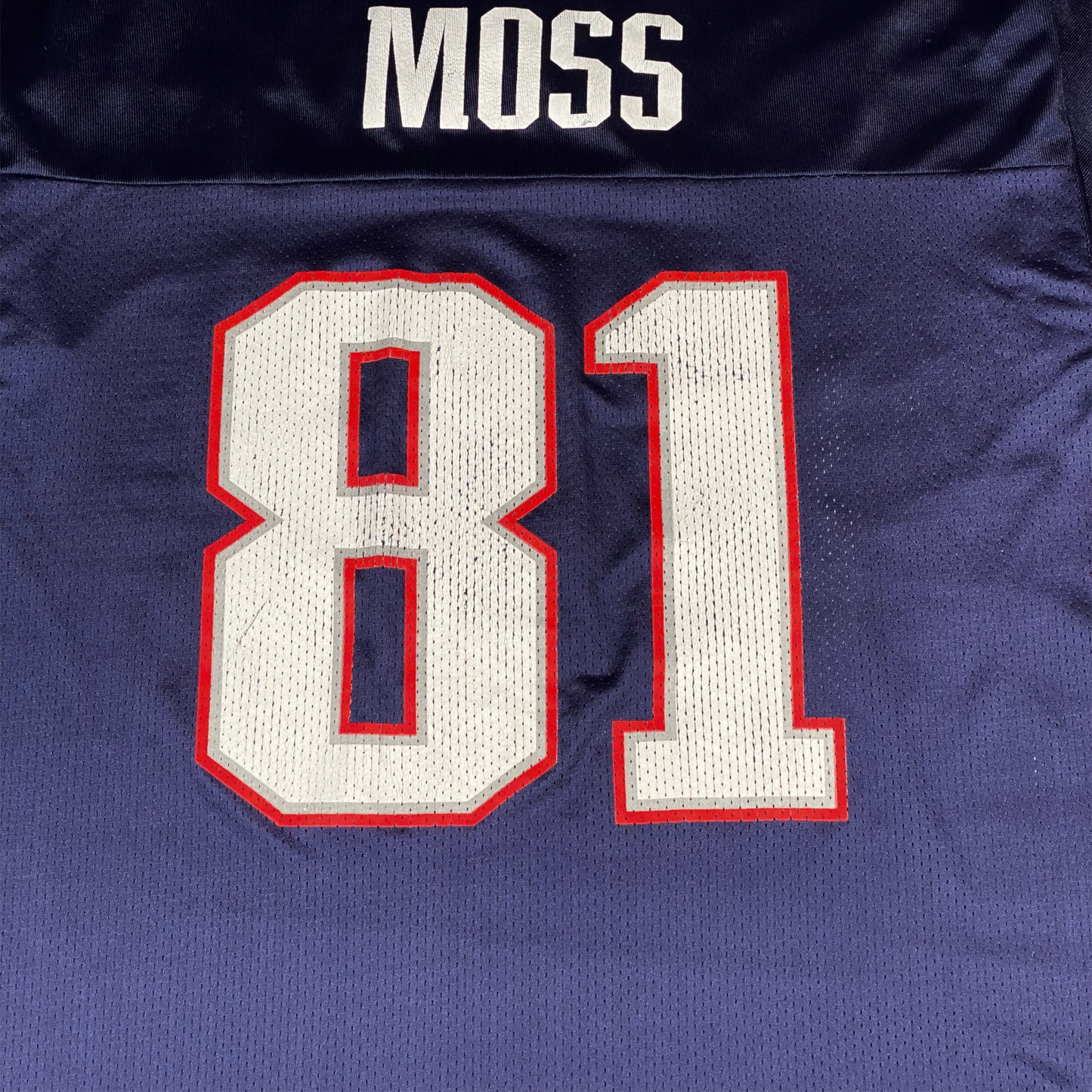 Digg It Thrift & Vintage navy blue New England Patriots Randy Moss jersey with white number 81 and nameplate