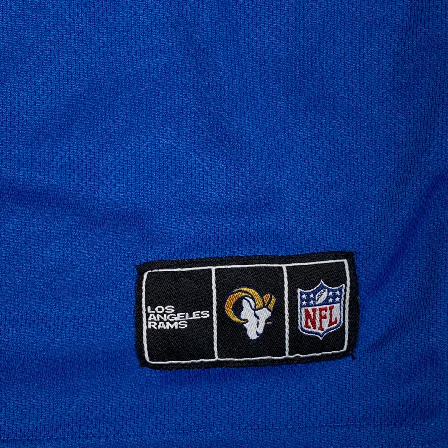 Digg It Thrift & Vintage blue Los Angeles Rams jersey featuring an embroidered NFL and team logo patch