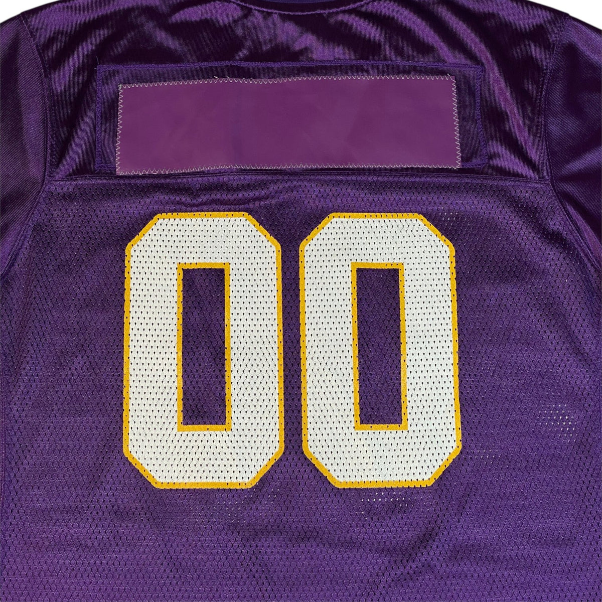 Digg It Thrift & Vintage purple Reebok Minnesota Vikings jersey with white and yellow 00 numbers on mesh fabric