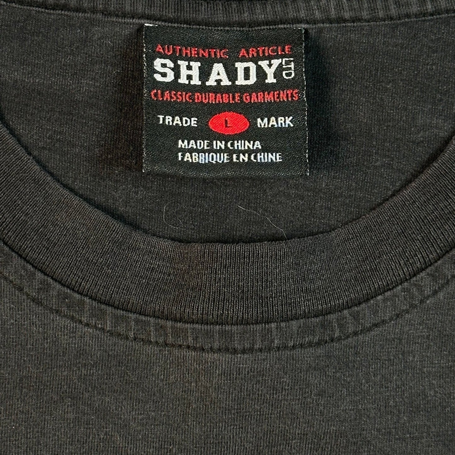 Digg It Thrift & Vintage authentic black Shady Ltd. Eminem Y2K t-shirt neck label showing size Large