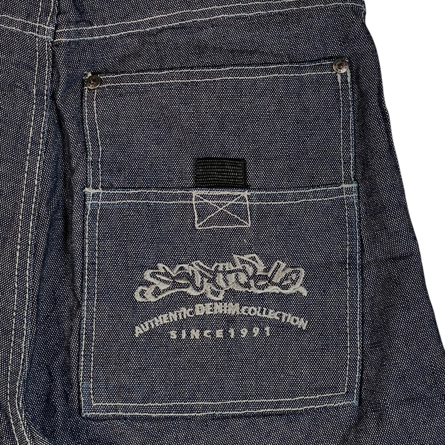 Digg It Thrift & Vintage Southpole baggy denim jorts featuring raw dark wash fabric and white contrast stitching