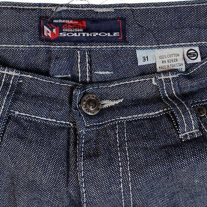 Digg It Thrift & Vintage Southpole baggy denim jorts featuring raw dark blue fabric and white contrast stitching.