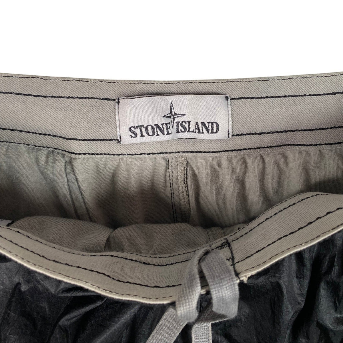 Digg It Thrift & Vintage Stone Island Nylon Metal Grid cargo shorts featuring an interior brand label and drawstring