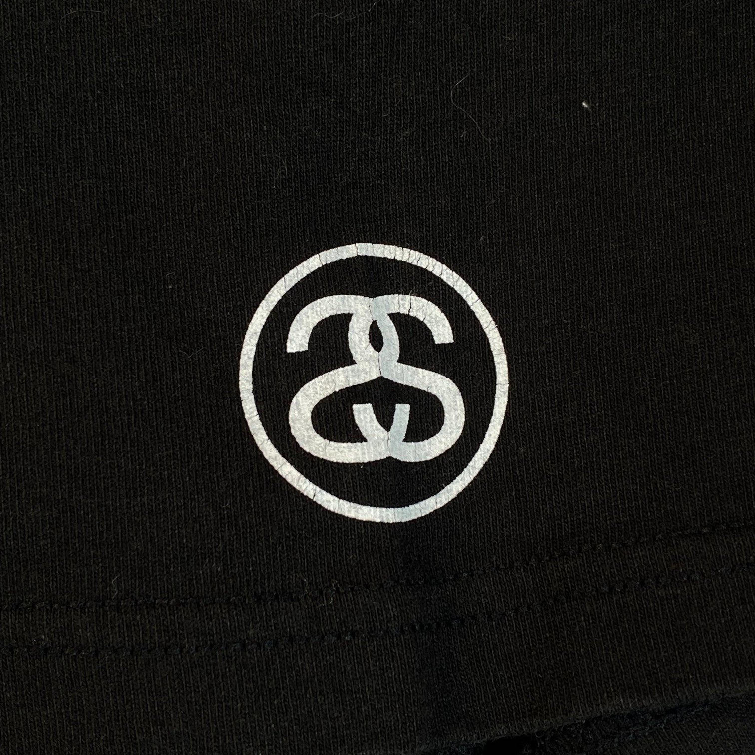 Digg It Thrift & Vintage black Stüssy graphic t-shirt with white circular logo detail