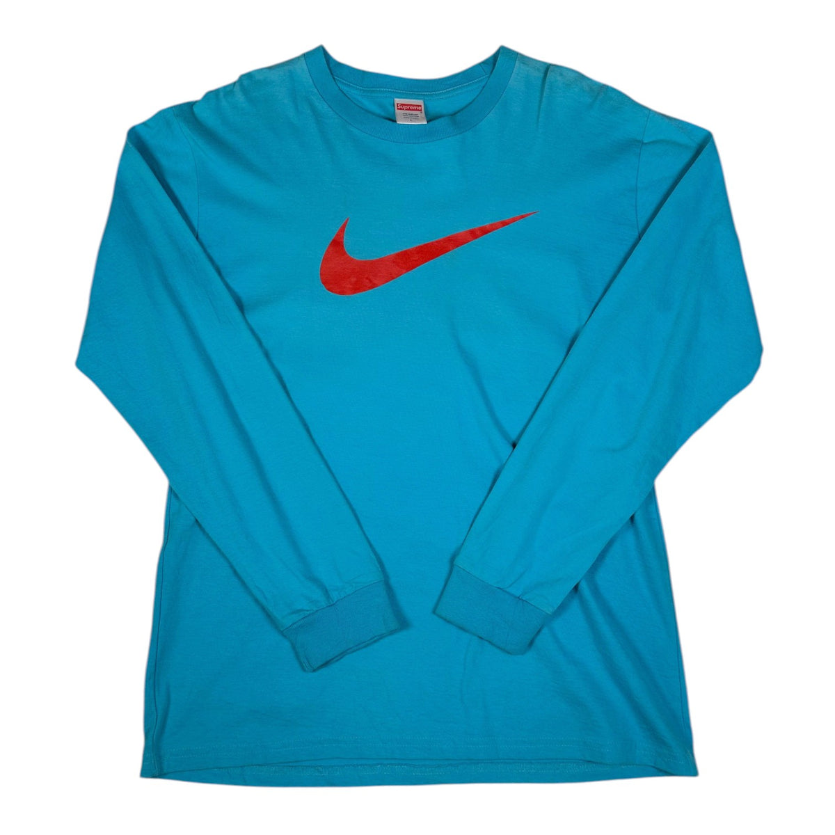 Digg It Thrift & Vintage teal blue Supreme x Nike long sleeve t-shirt with a large red swoosh logo on the chest