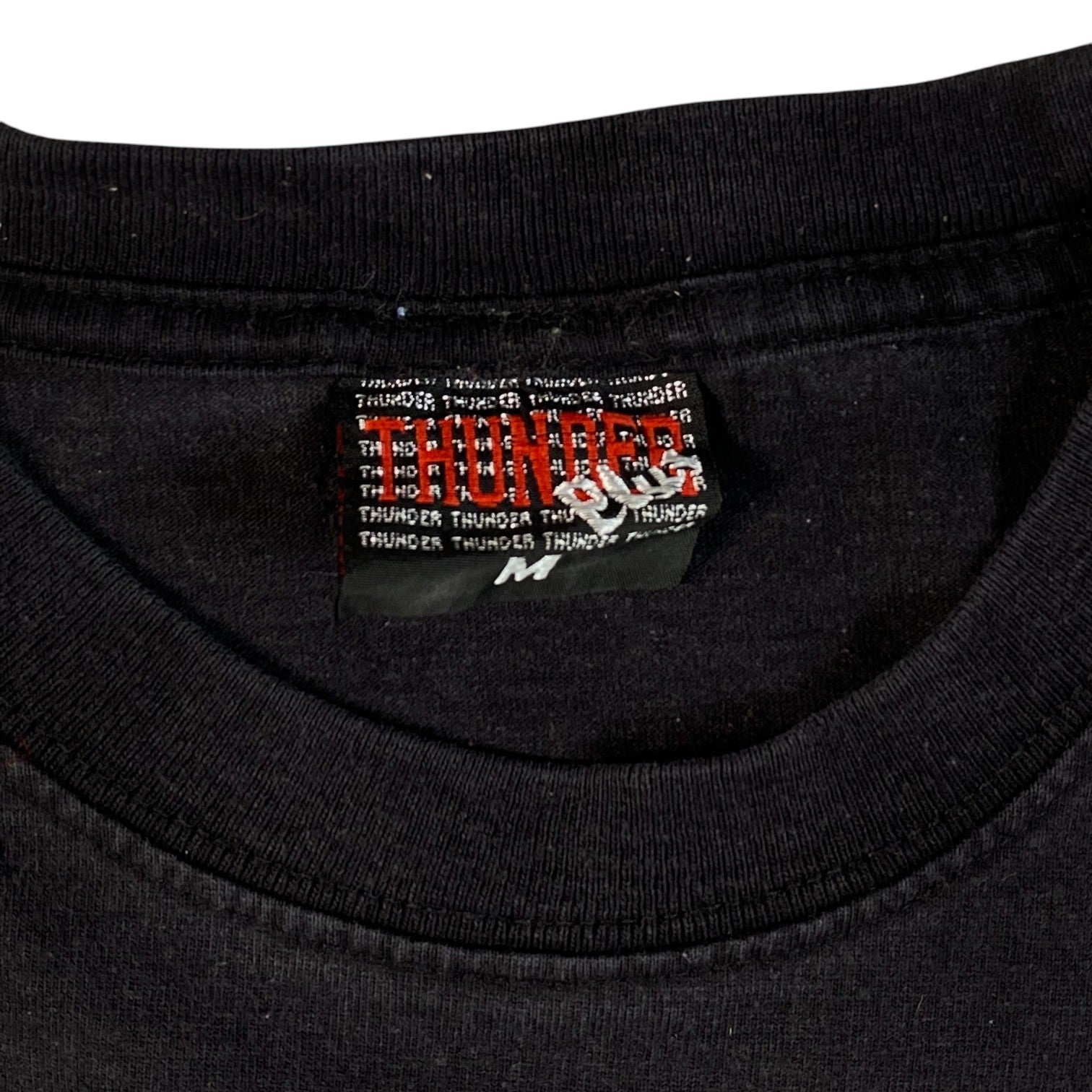 Digg It Thrift & Vintage black Thunder brand t-shirt with size M tag, featuring a vintage graphic style.
